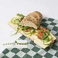 Half an organic baguette with matured cheese