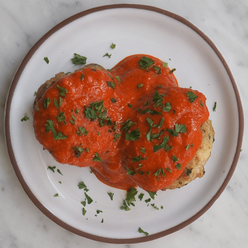 Meatballs of chicken with sage and mature cheese in tomato sauce