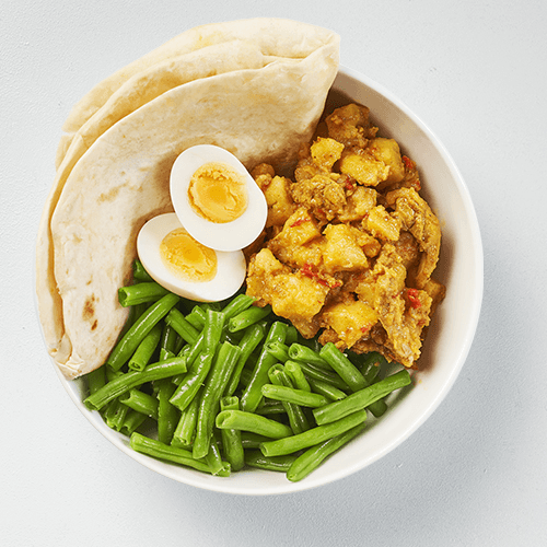 Surinamese roti with chicken, green beans and egg