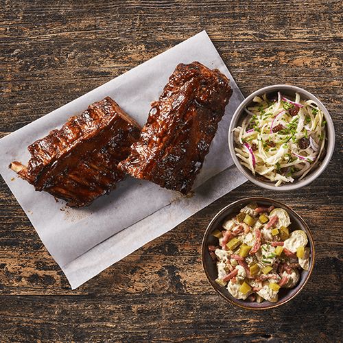 Marinated spareribs with coleslaw and potato salad