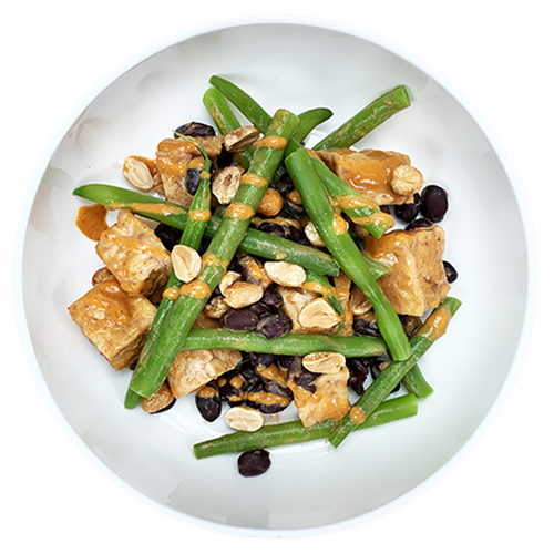 Fried tofu and green beans in peanut sauce bowl