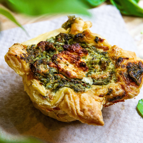 Homemade quiche with spinach and goat cheese
