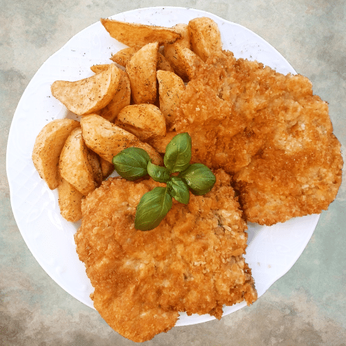 Varkensschnitzel met champignonsaus