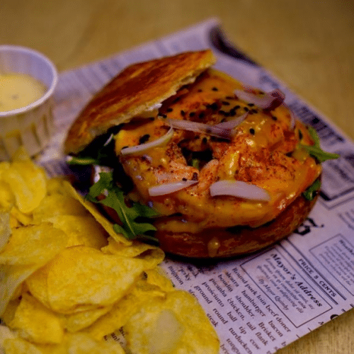 Grilled salmon croissant burger